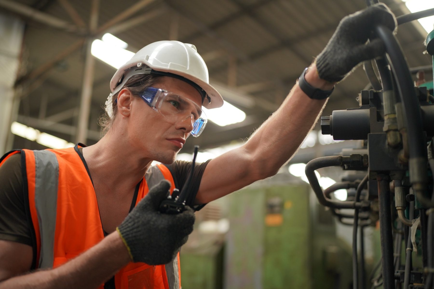 Maintenance Engineers is working in front of the automated CNC machinery repair on a maintenance che
